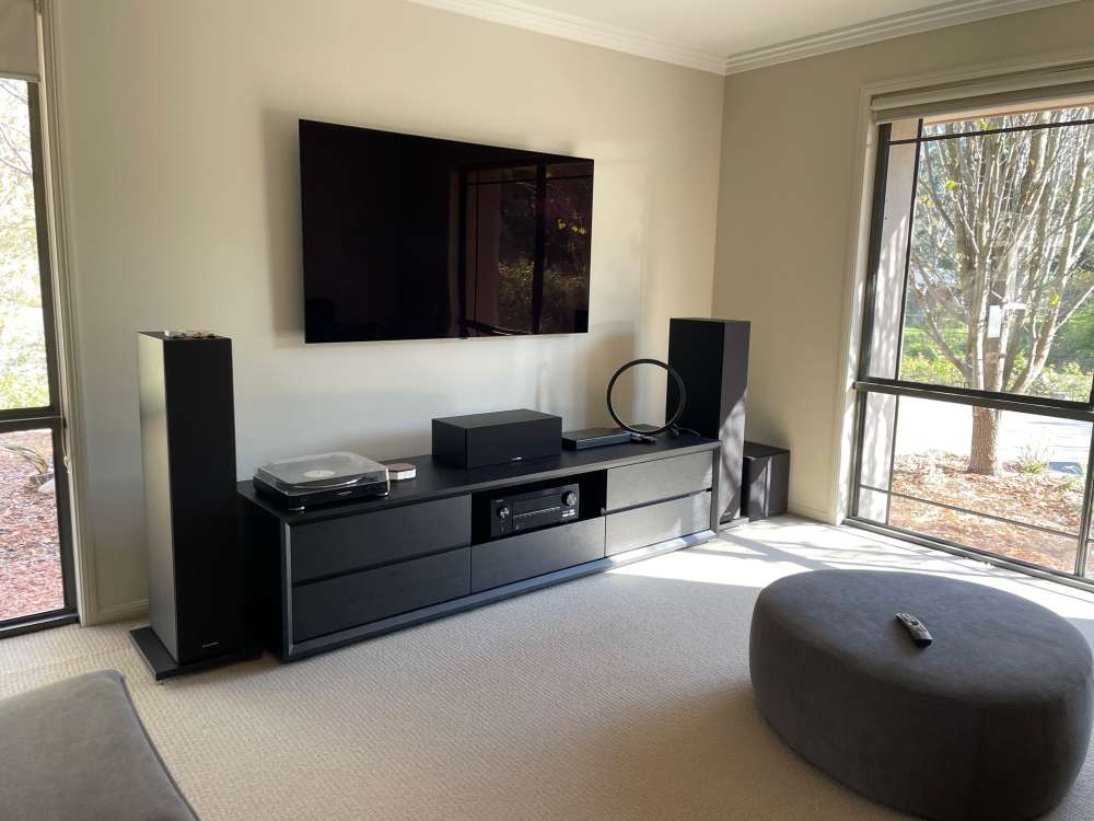 Home theatre front view display an LG tv, Denon amplifer and Bowers and Wilkins speakers